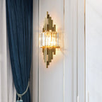 Decorative wall sconce on a white wall with a blue curtain to the left.