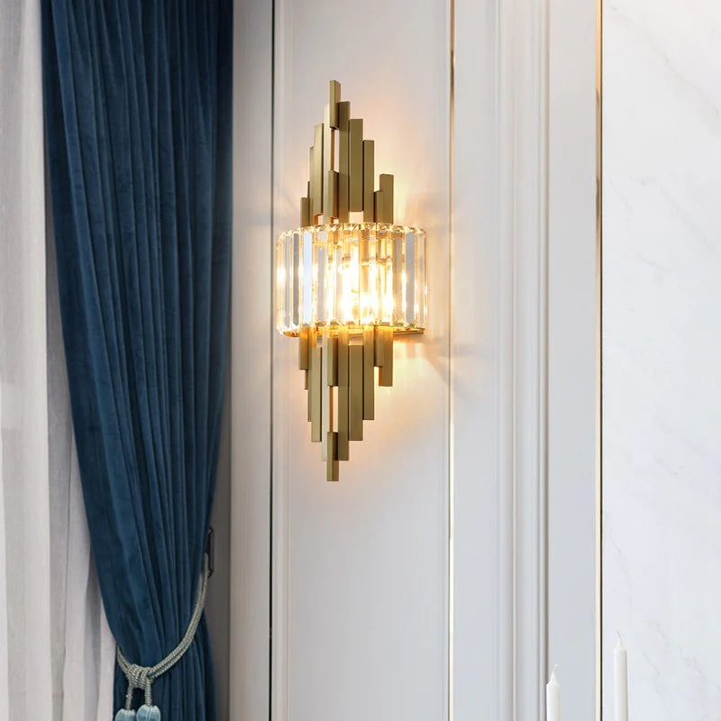 Decorative wall sconce on a white wall with a blue curtain to the left.