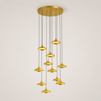 Gold pendant light fixture on a plain background