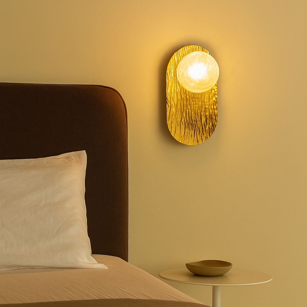 Bedroom with a wall-mounted light fixture casting a warm glow.
