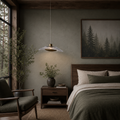 Cozy bedroom with wooden furniture, pendant light, and forest-themed decor.