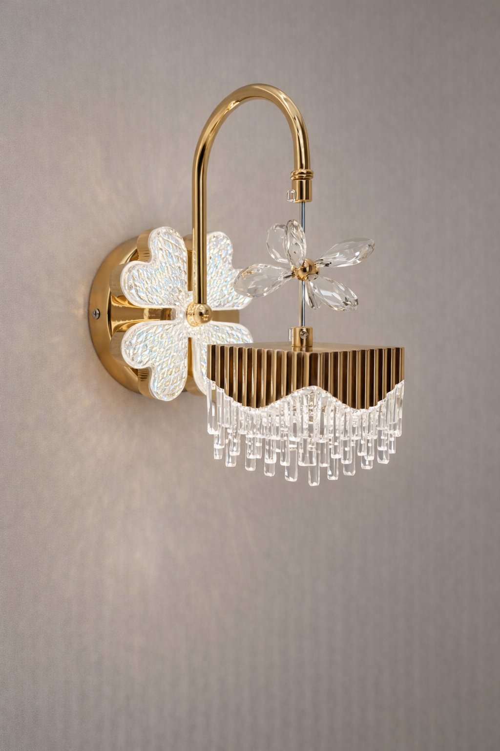 Decorative wall light fixture with floral design on a gray background
