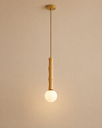 Pendant light with bamboo-style fixture on a beige background