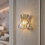Decorative wall sconce with crystal design on a neutral wall.