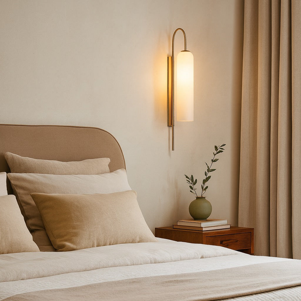 Neatly made bed with beige bedding in a bedroom setting.