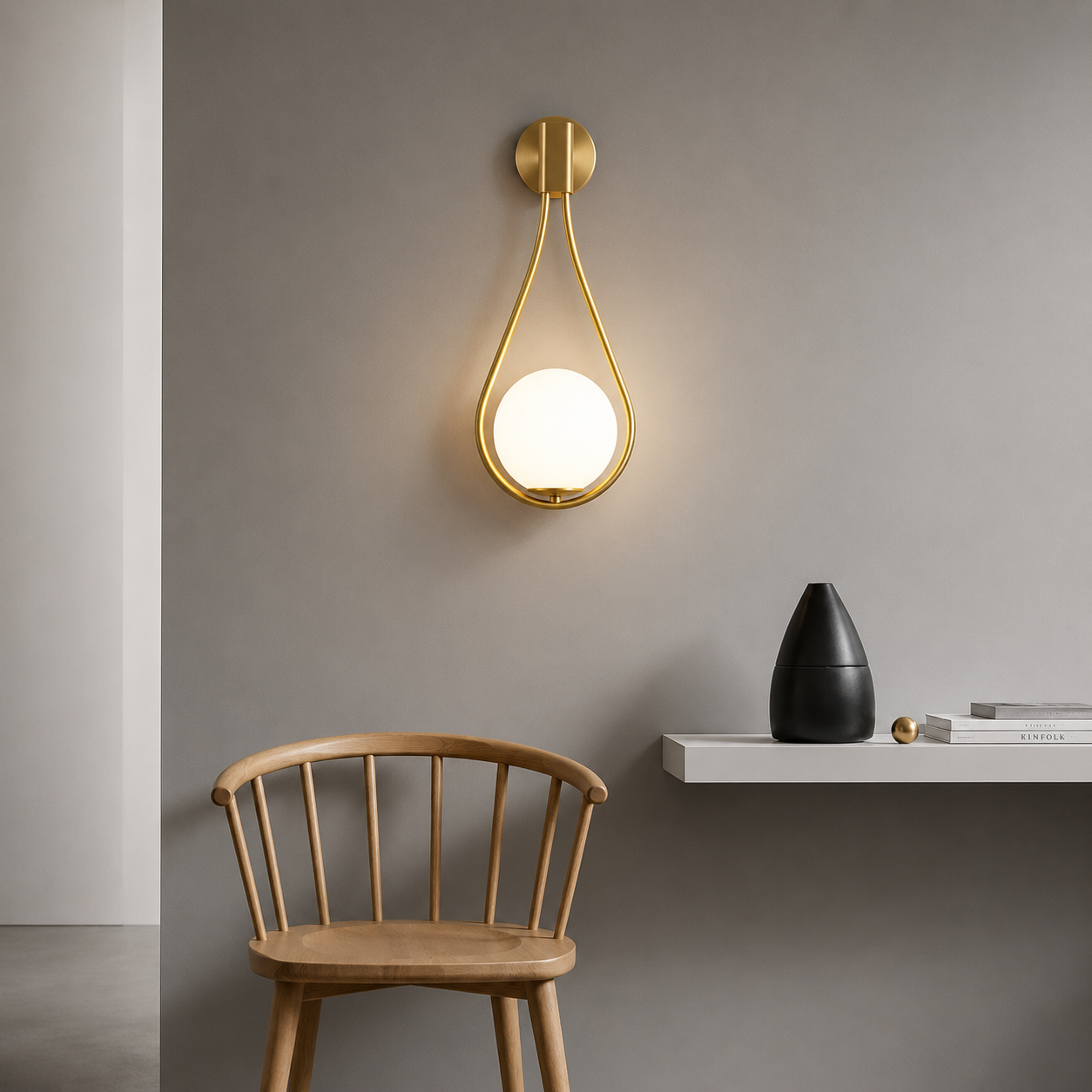 Modern wall light fixture on a gray wall with a wooden chair and black vase in the foreground.