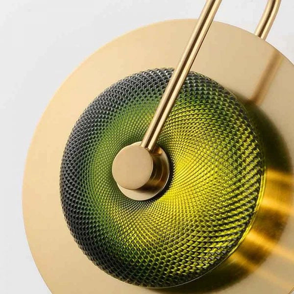 Close-up of a gold and green textured object on a light gray background