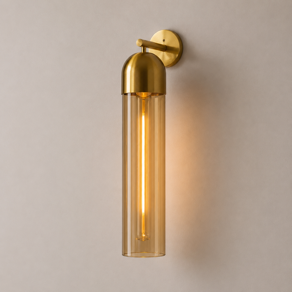 Gold wall-mounted light fixture on a beige wall