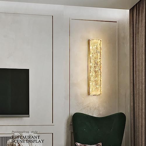 Modern wall-mounted light fixture on a neutral wall with a green chair and text overlay.
