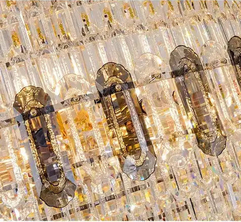 Decorative crystal fixture with gold accents on a white background