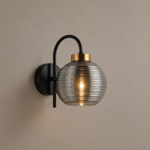 Wall-mounted light fixture with glass shade and black arm on a beige wall