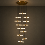 Modern chandelier with gold accents on a dark background