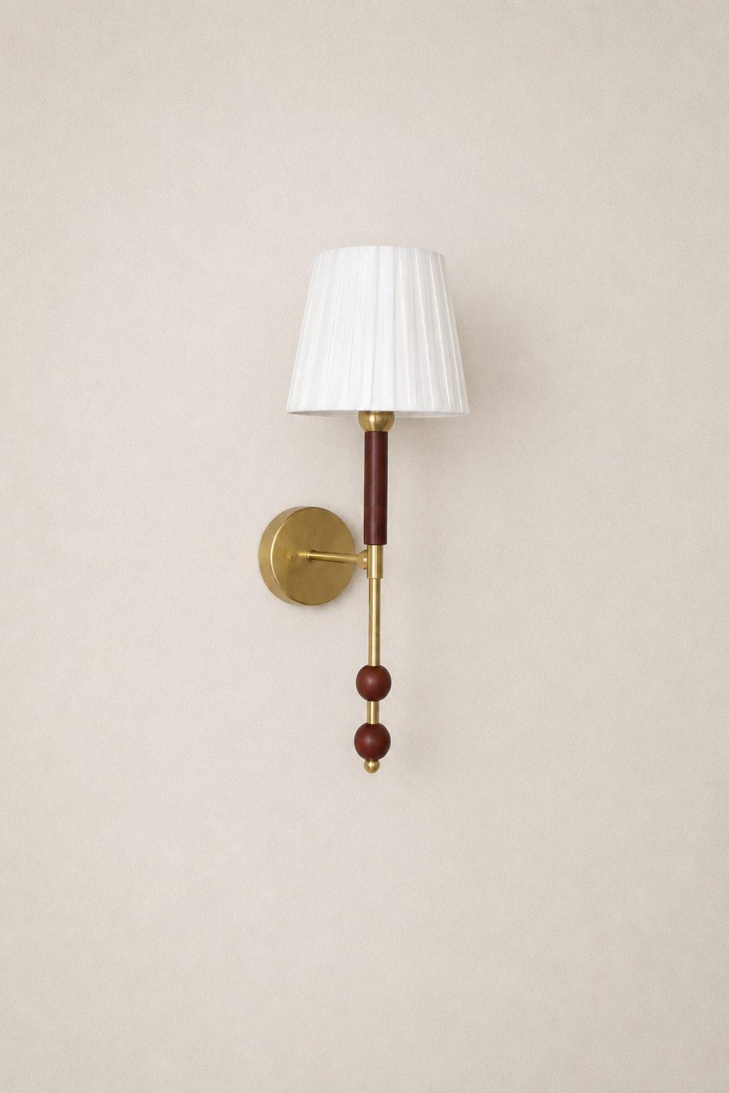 Wall sconce with white lampshade and wooden accents on a beige wall