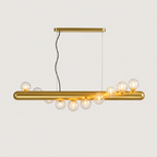 Gold pendant light with multiple bulbs on a white background