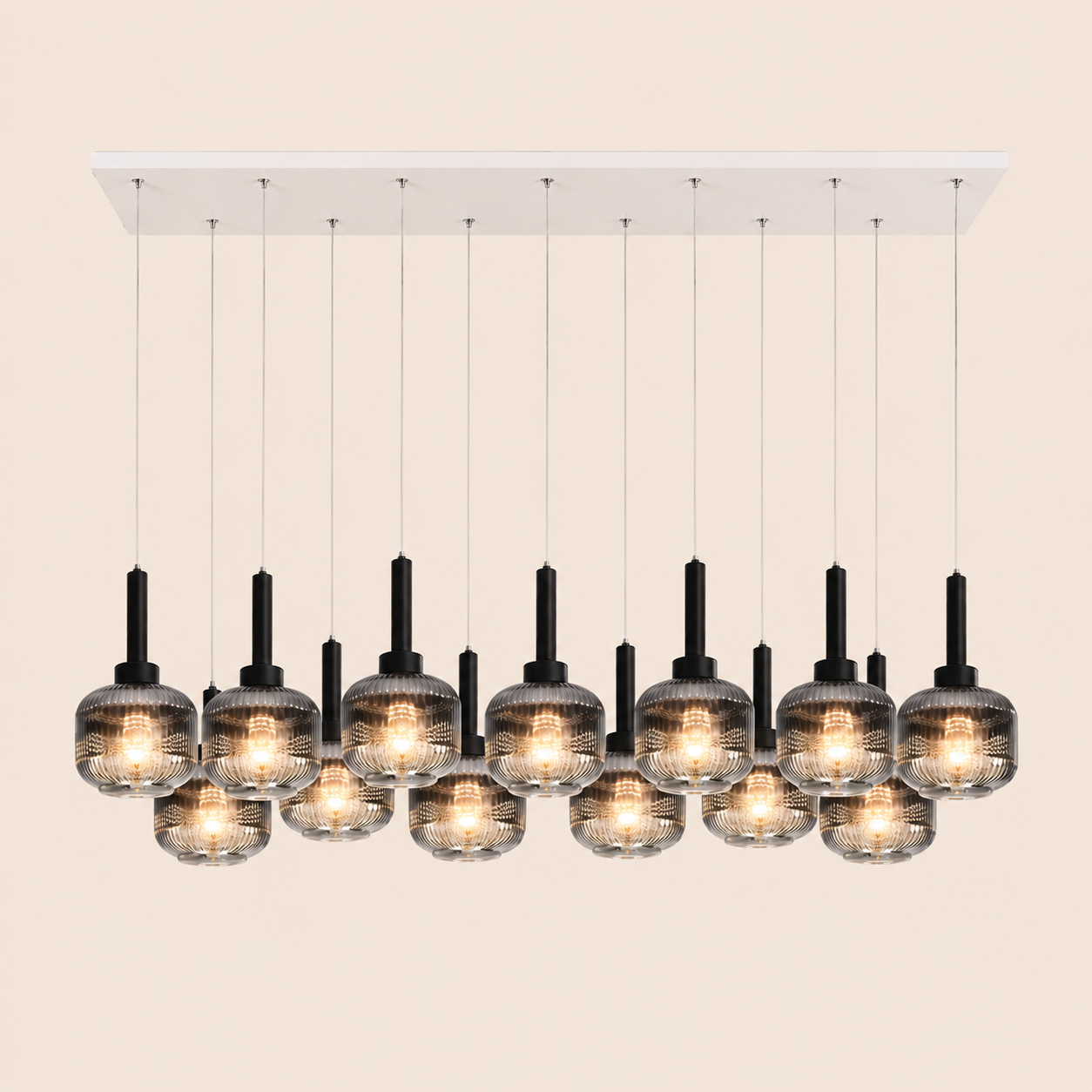 Modern chandelier with multiple glass lampshades on a beige background