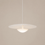 Modern pendant light with textured shade on a beige background