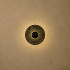 Decorative wall light fixture on a beige wall