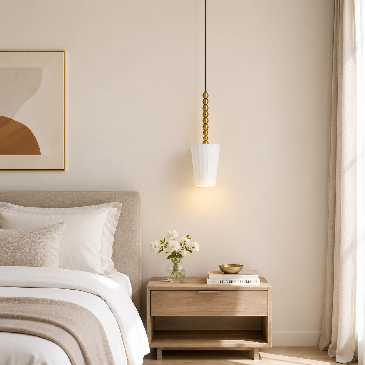 Neatly made bed with a nightstand featuring a lamp and decorative items in a bedroom setting.