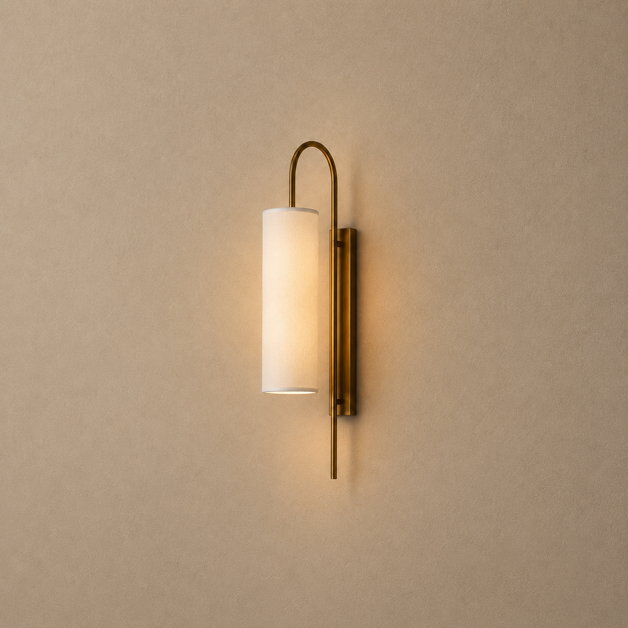 Wall-mounted lamp with a cylindrical shade on a beige wall