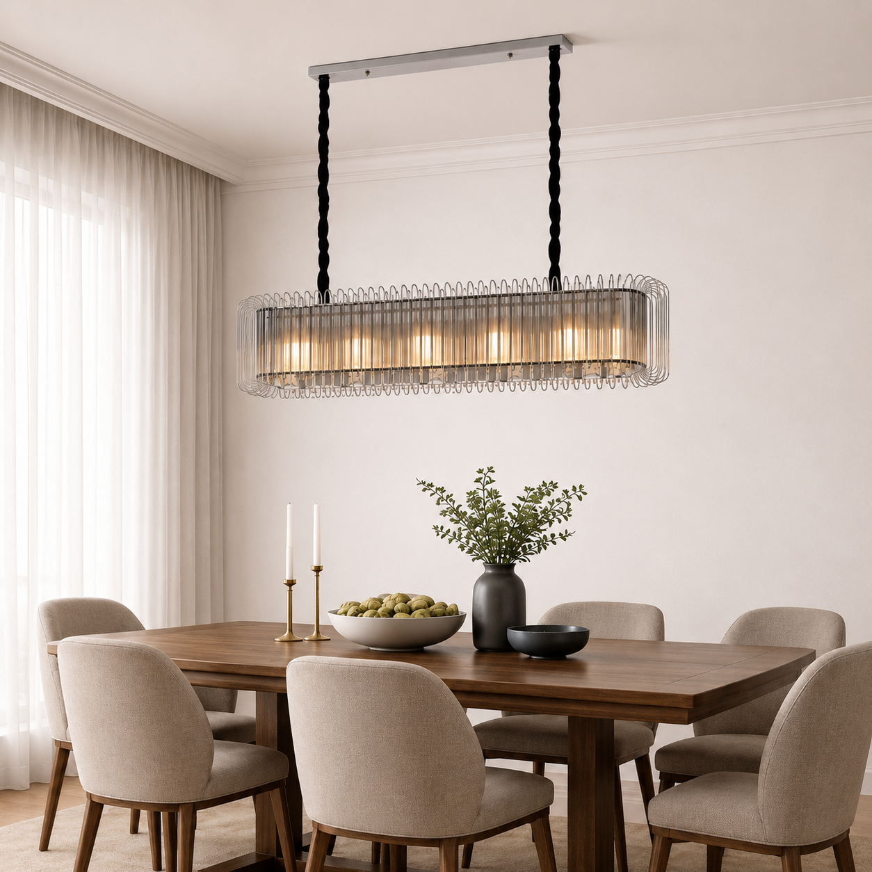 Dining room with a modern pendant light fixture, wooden table, and chairs.