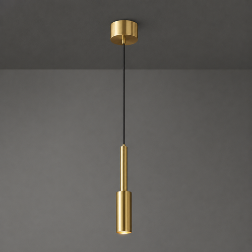 Gold pendant light fixture on a gray background