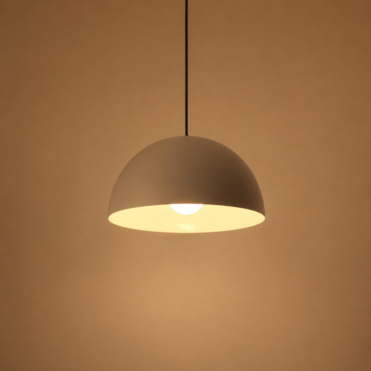 Gray pendant light on a brown background