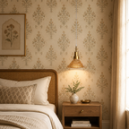 Cozy bedroom with floral wallpaper, wooden bed, and nightstand with lamp.