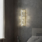 Wall-mounted light fixture on a textured wall in a bedroom setting
