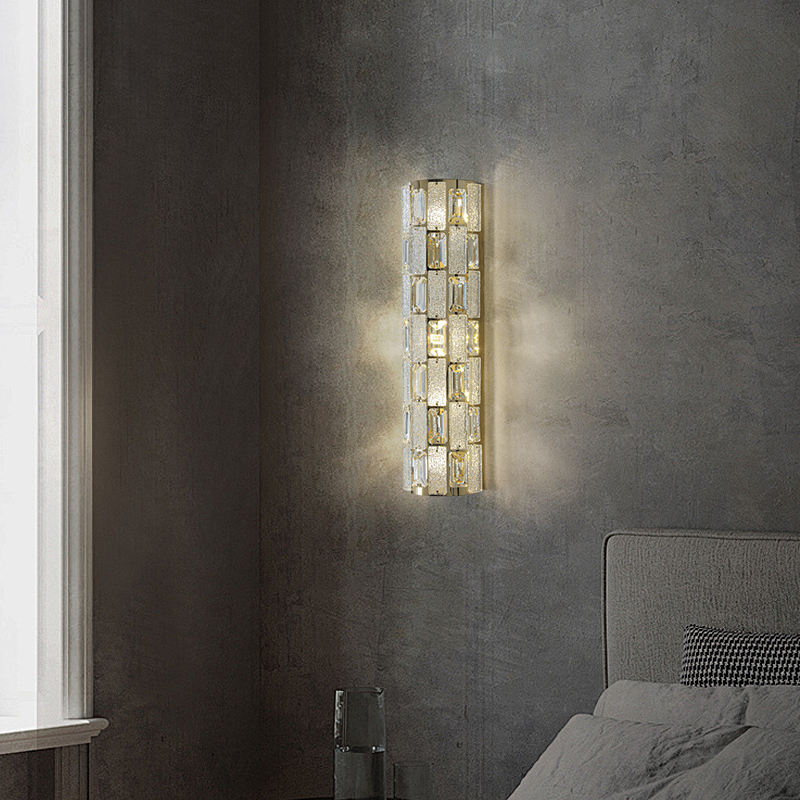 Wall-mounted light fixture on a textured wall in a bedroom setting