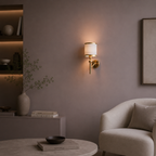 Modern living room with a wall-mounted lamp, round table, and armchair.