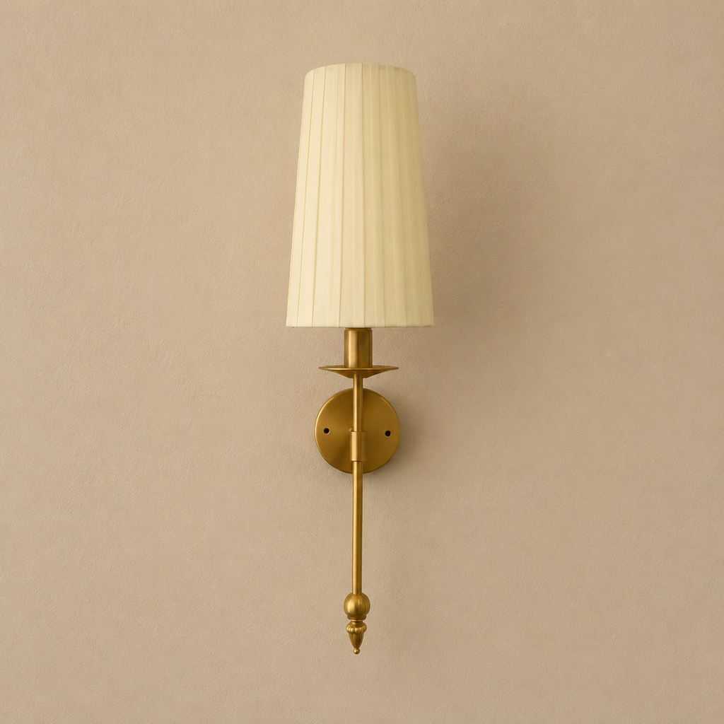 Wall-mounted lamp with pleated white shade on a beige wall
