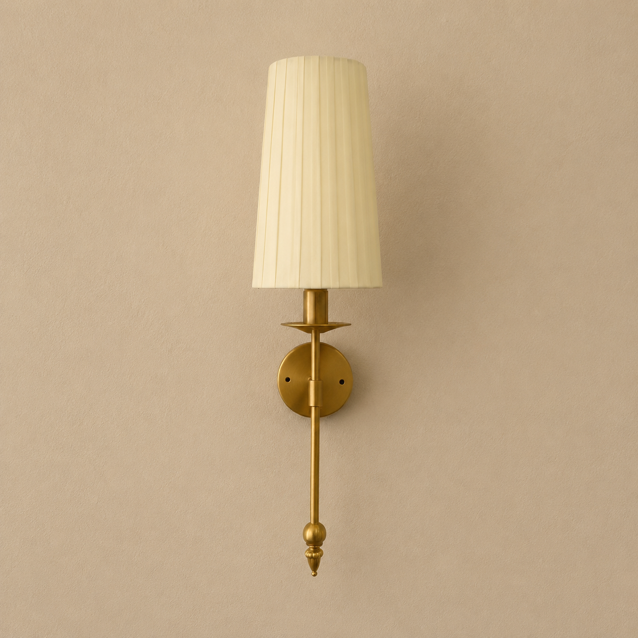Wall-mounted lamp with pleated white shade on a beige wall